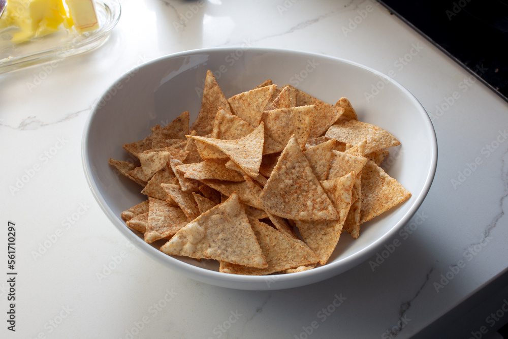 A view of a bowl of cassava snack chips. A view of a bowl of cassava snack chips.