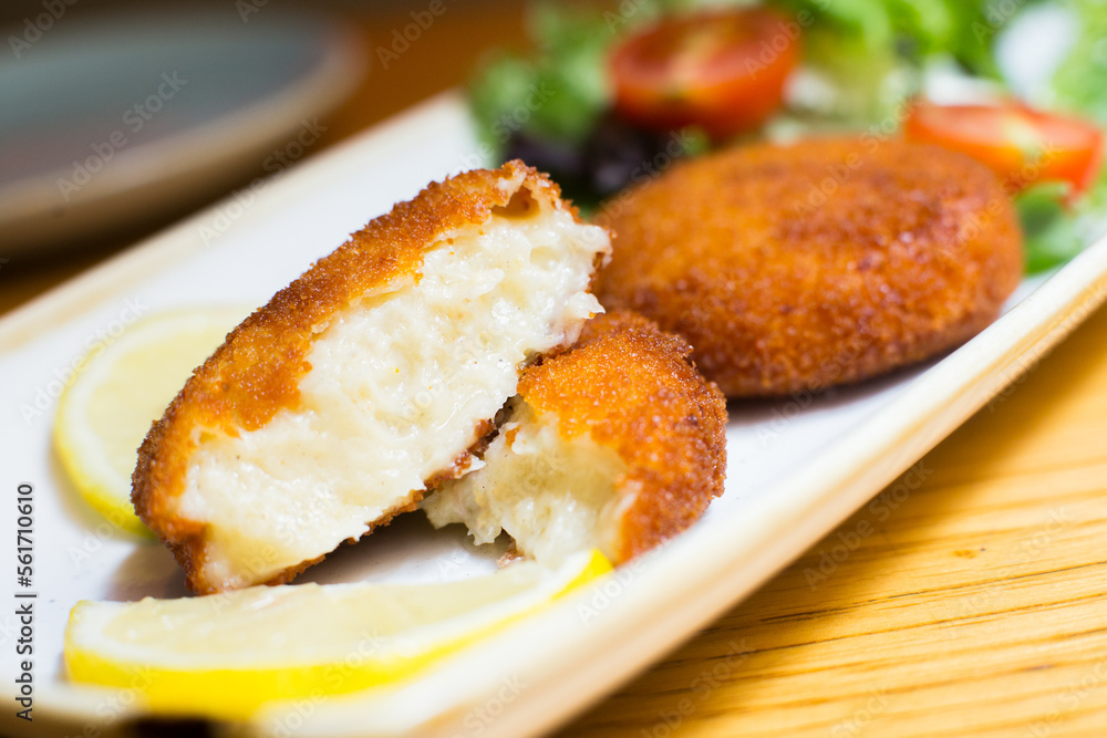 Spanish croquettes tapa. The croquette is a portion of dough made from a dense sauce such as bechamel and a mincemeat of various ingredients. Spanish croquettes tapa. The croquette is a portion of dough made from a dense sauce such as bechamel and a mincemeat of various ingredients.