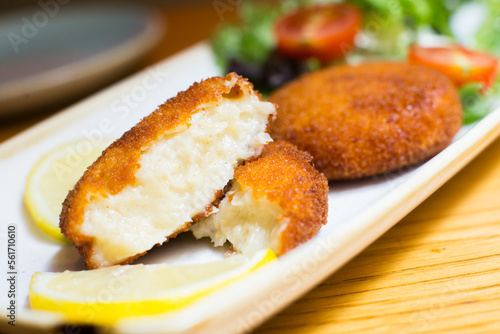 Spanish croquettes tapa. The croquette is a portion of dough made from a dense sauce such as bechamel and a mincemeat of various ingredients.