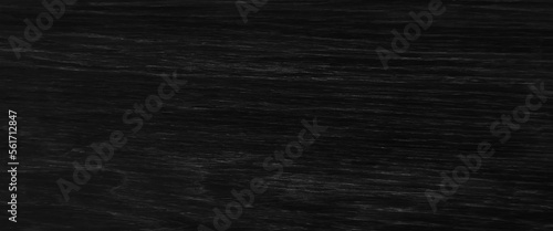 Dark wood background, old black wood texture for background, Black wood texture seamless high resolution, black paper house on black wood background, real estate concept.
