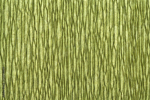 Texture of green crepe paper close up. Decor paper