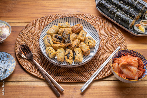 Crispy seaweed noodle rolls or Gimmari Korean deep-fried seaweed rolls, Korean traditional snack food. photo