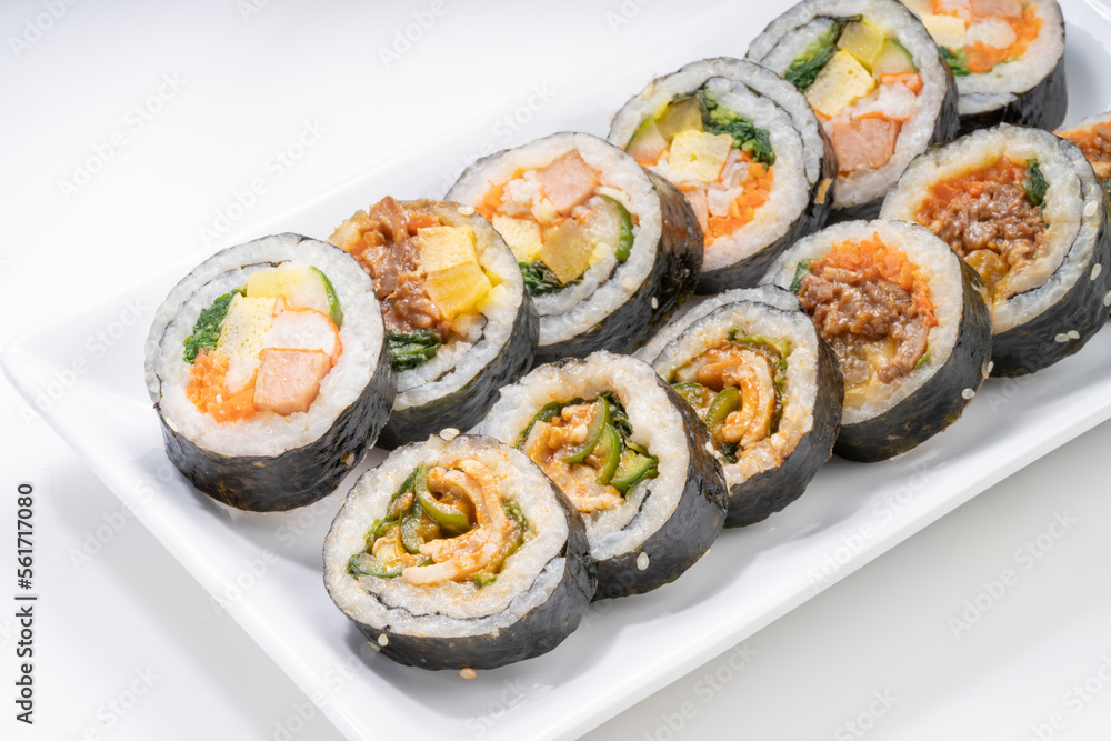 Korean Seaweed Rice Rolls or Kimbap Korean dish made from cooked rice vegetables, meats that are rolled in seaweed, Bulgogi Kimbap and pork bbq Kimbap Korean food. Korean Seaweed Rice Rolls or Kimbap Korean dish made from cooked rice vegetables, meats that are rolled in seaweed, Bulgogi Kimbap and pork bbq Kimbap Korean food.