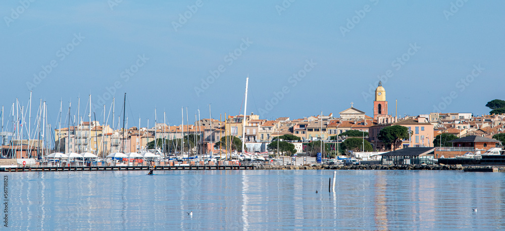 Saint Tropez view from far away with palm trees water and blue sky Saint Tropez view from far away with palm trees water and blue sky