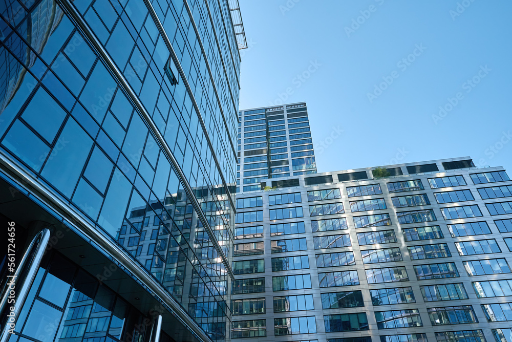 Detail of skyscraper office buildings with glass facades. Modern urban architecture. High rise building in downtown of Warsaw city Detail of skyscraper office buildings with glass facades. Modern urban architecture. High rise building in downtown of Warsaw city