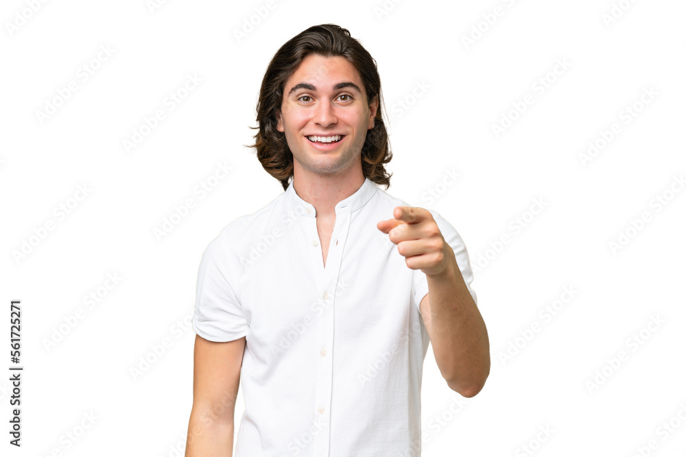 Young caucasian man isolated on green chroma background surprised and pointing front Young caucasian man isolated on green chroma background surprised and pointing front