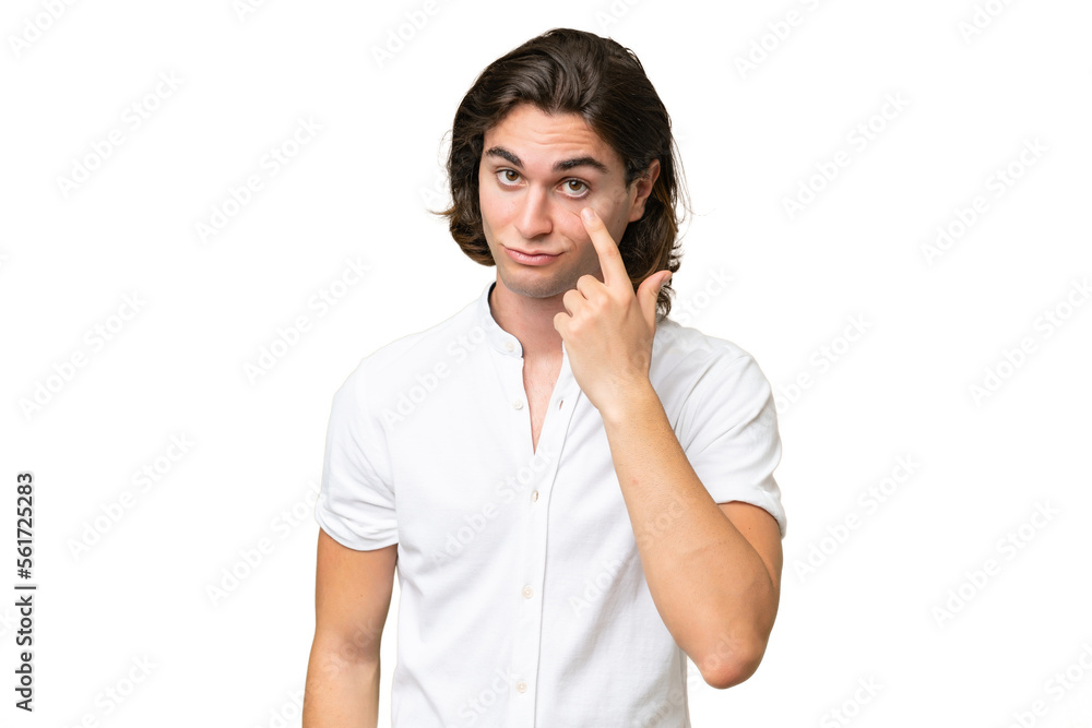 Young caucasian man isolated on green chroma background showing something Young caucasian man isolated on green chroma background showing something