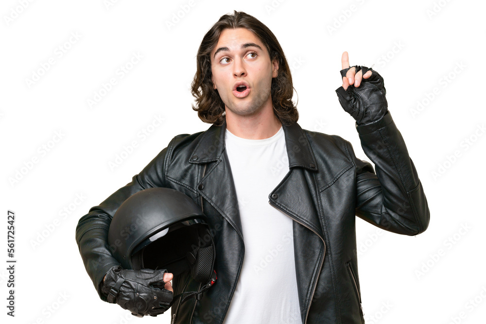 Young handsome man with a motorcycle helmet isolated on green chroma background thinking an idea pointing the finger up Young handsome man with a motorcycle helmet isolated on green chroma background thinking an idea pointing the finger up