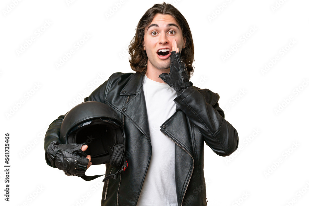 Young handsome man with a motorcycle helmet isolated on green chroma background with surprise and shocked facial expression Young handsome man with a motorcycle helmet isolated on green chroma background with surprise and shocked facial expression