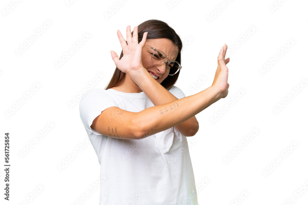 Young caucasian woman isolated on green chroma background nervous stretching hands to the front Young caucasian woman isolated on green chroma background nervous stretching hands to the front