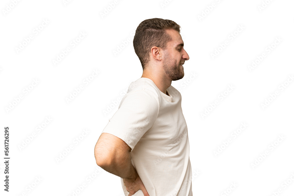 Young handsome caucasian man isolated on green chroma background suffering from backache for having made an effort Young handsome caucasian man isolated on green chroma background suffering from backache for having made an effort