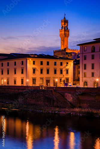 Famous Palazzo Vecchio Palace and the river Arno at sunset, Florence, Italy