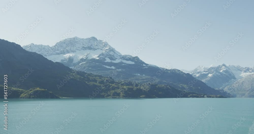Alaska Glacier Bay National Park,USA. Amazing glacial landscape showing mountain peaks and glaciers on clear blue sky summer day. SLOW MOTION VIDEO Alaska Glacier Bay National Park,USA. Amazing glacial landscape showing mountain peaks and glaciers on clear blue sky summer day. SLOW MOTION VIDEO