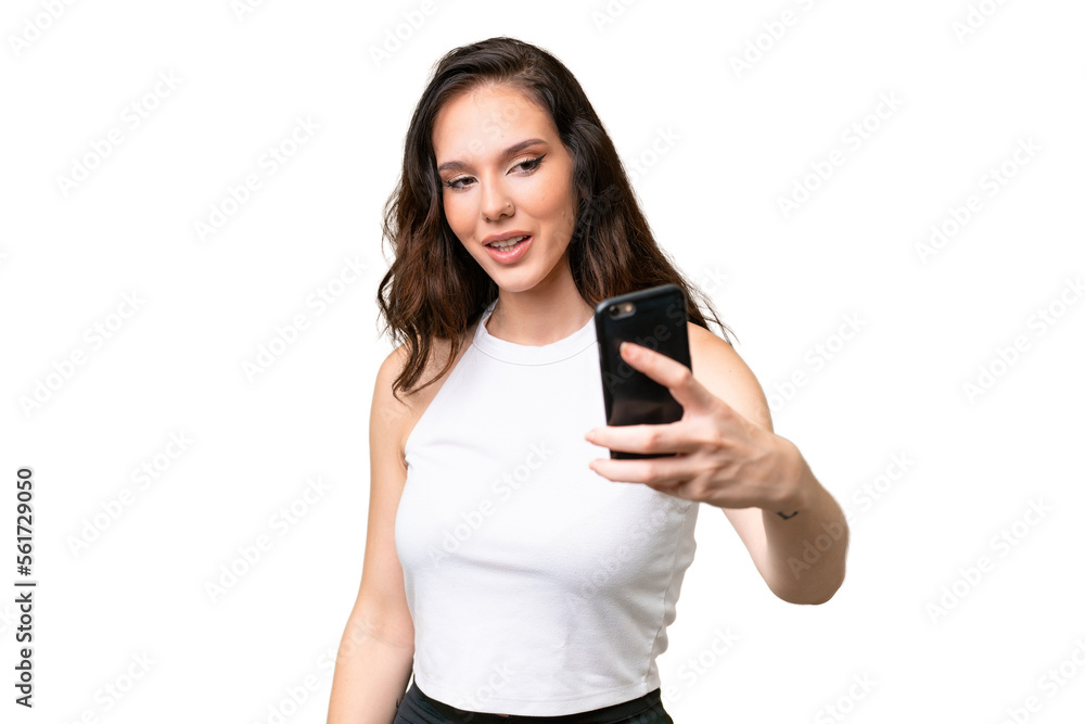 Young caucasian woman isolated over isolated background making a selfie Young caucasian woman isolated over isolated background making a selfie