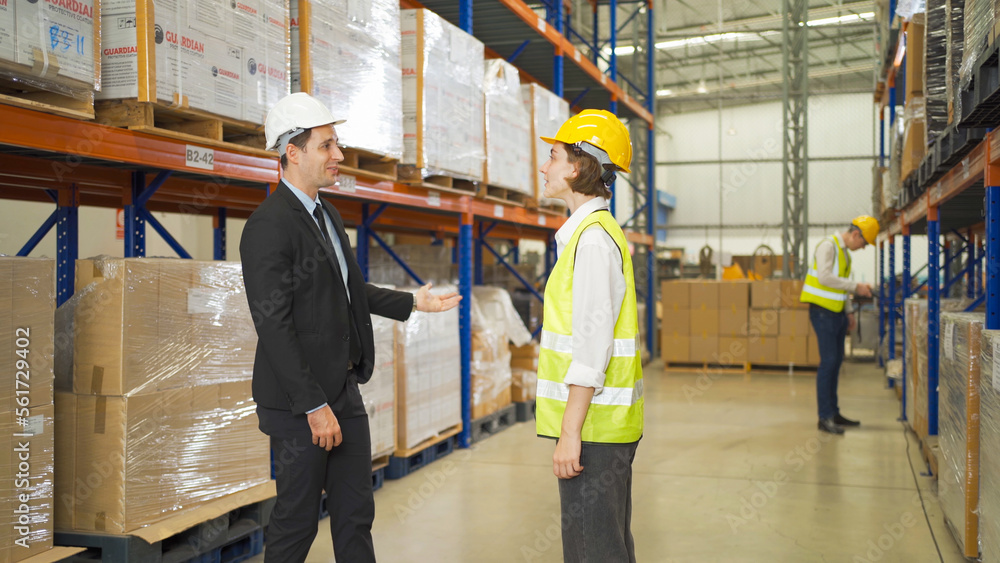 Teamwork of workers working in large warehouse retail store industry.Rack of stock storage. Interior of cargo in ecommerce and logistic concept. Depot. People lifestyle. Shipment service for container Teamwork of workers working in large warehouse retail store industry.Rack of stock storage. Interior of cargo in ecommerce and logistic concept. Depot. People lifestyle. Shipment service for container