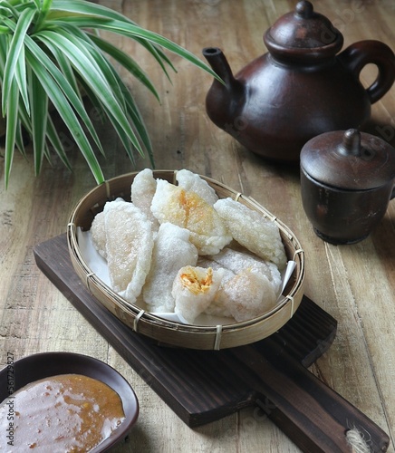 cireng is Indonesian food made from tapioca flour with shredded chicken filling served with peanut sauce photo