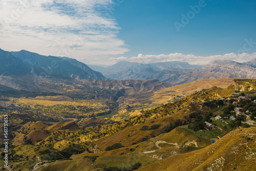 Snow-capped mountains and autumn fields. Beautiful mountain landscape in winter. Panoramic view, Dagestan, Russia. © Aleksei Zakharov