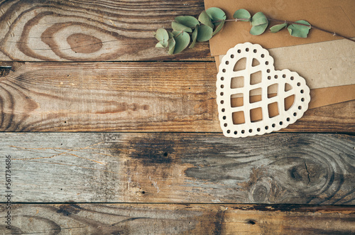 Decorative heart and letters on wooden background, flat lay.