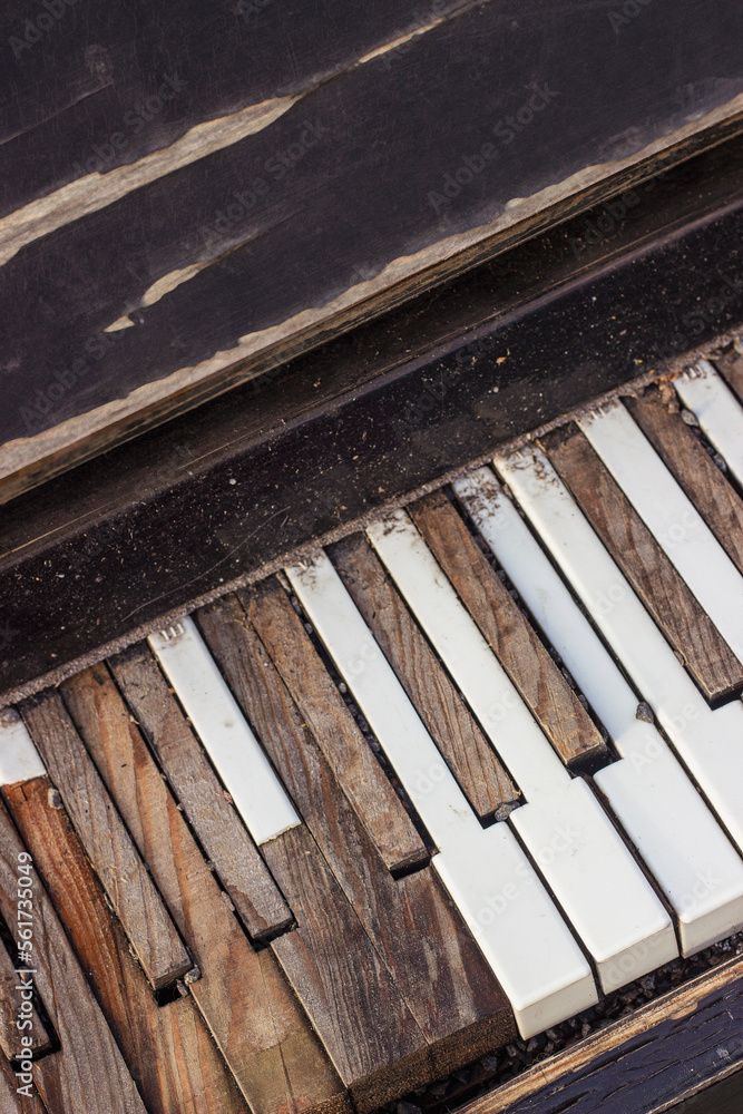Old broken piano. Keyboard with broken, peeled piano keys. Old broken piano. Keyboard with broken, peeled piano keys.