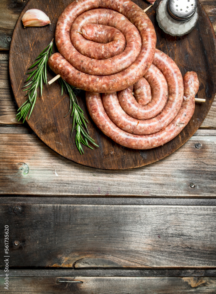 Raw sausage with rosemary and garlic. Raw sausage with rosemary and garlic.