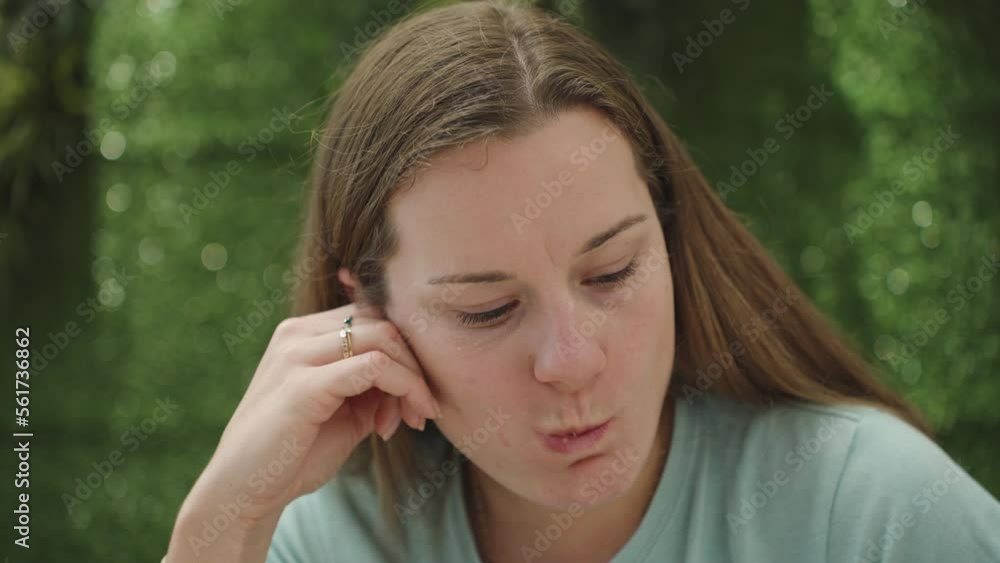 The girl in the cafe is a puff pastry roll. Close-up, a wall of green grass behind. The girl in the cafe is a puff pastry roll. Close-up, a wall of green grass behind.