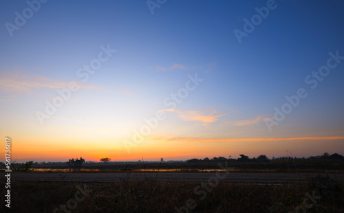 Panoramic view of dawn sky in country field.