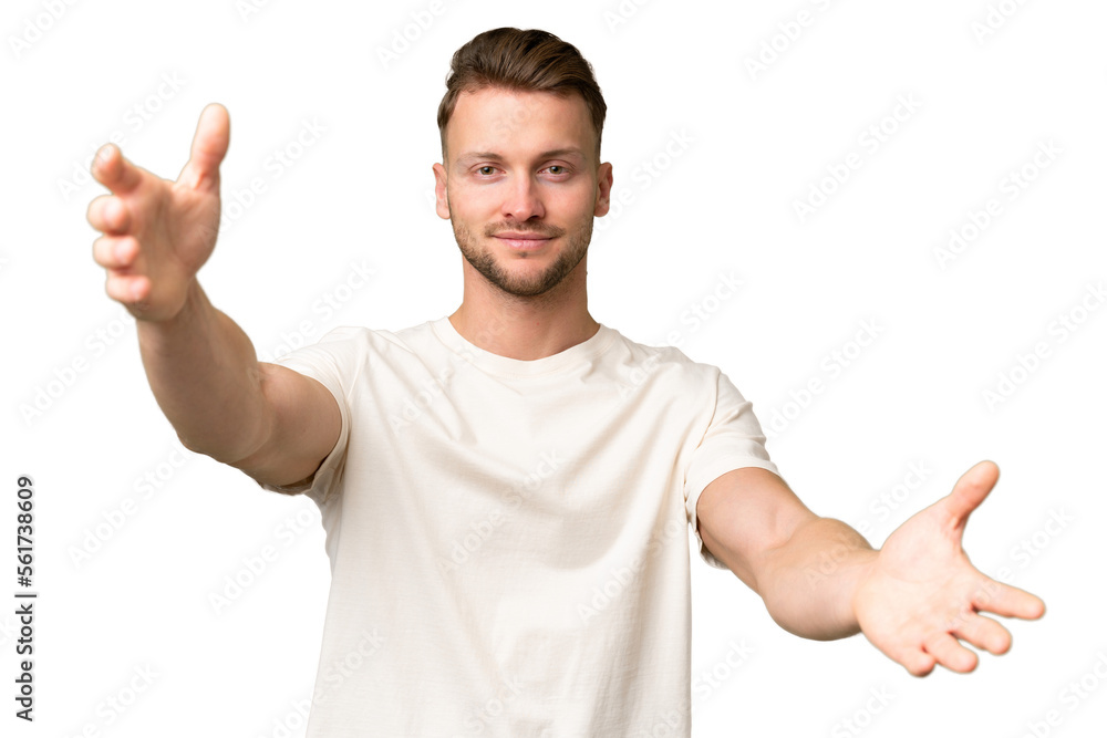 Young blonde caucasian man over isolated background presenting and inviting to come with hand Young blonde caucasian man over isolated background presenting and inviting to come with hand