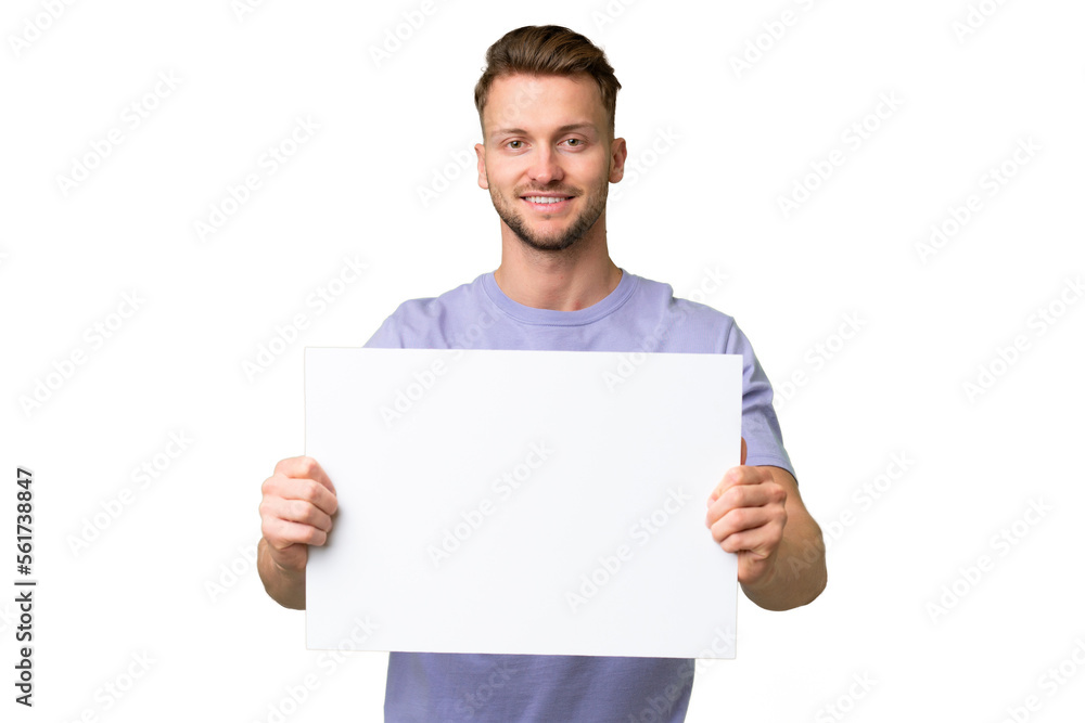Young blonde caucasian man over isolated background holding an empty placard with happy expression Young blonde caucasian man over isolated background holding an empty placard with happy expression