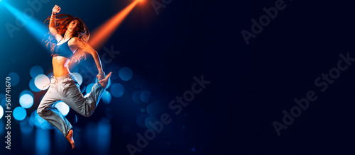 Athletic woman dancing on stage