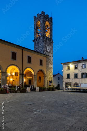 Building of Torre Tarlati o dell'orologio in Bibbiena under clear blue sky photo