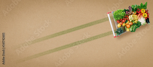 Fototapeta Naklejka Na Ścianę i Meble -  Shopping cart full of fresh vegetables and fruits