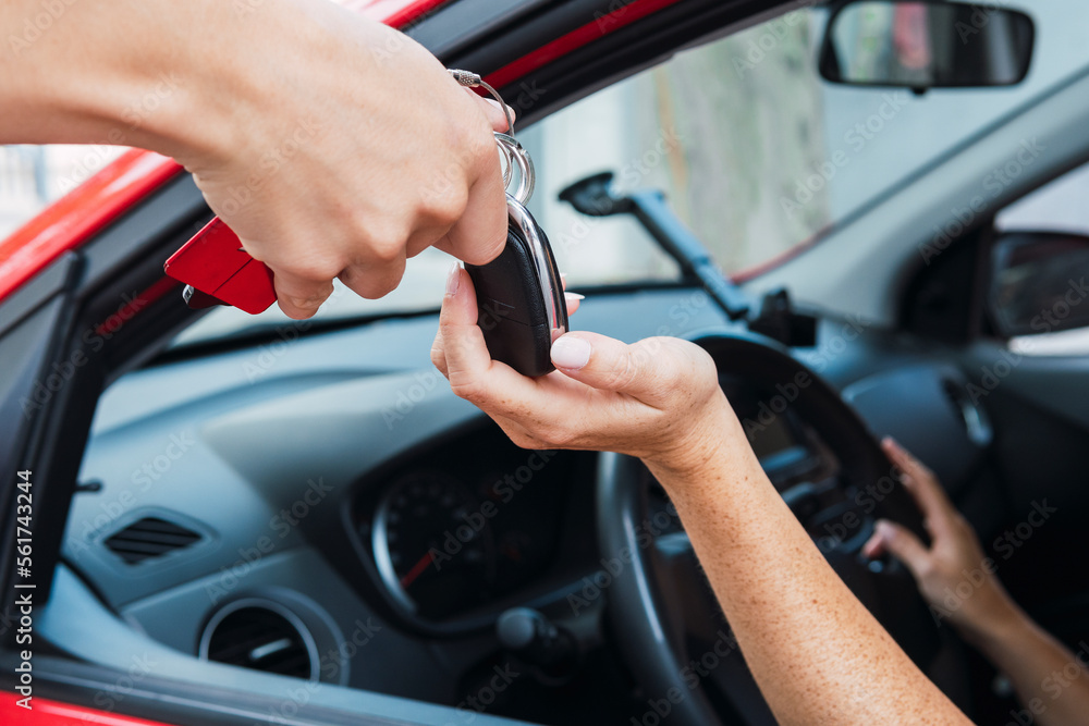 Salesman handling keys to customer Salesman handling keys to customer