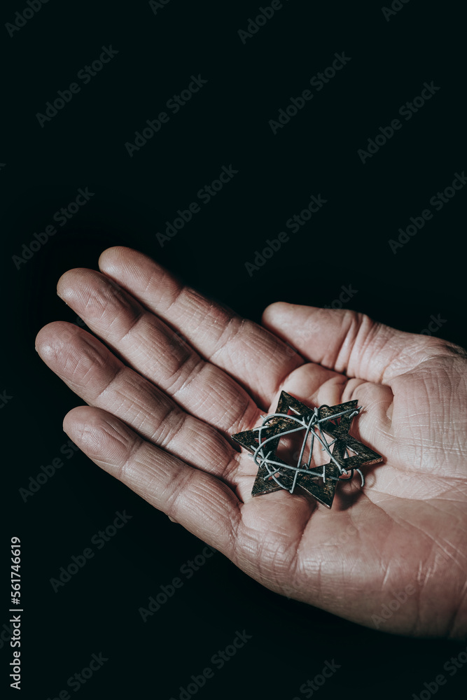 man with a star of david tied with barbed wire - obrazy, fototapety, plakaty 