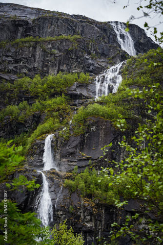 Waterfall cascade on a steep fjord landscape in Norway