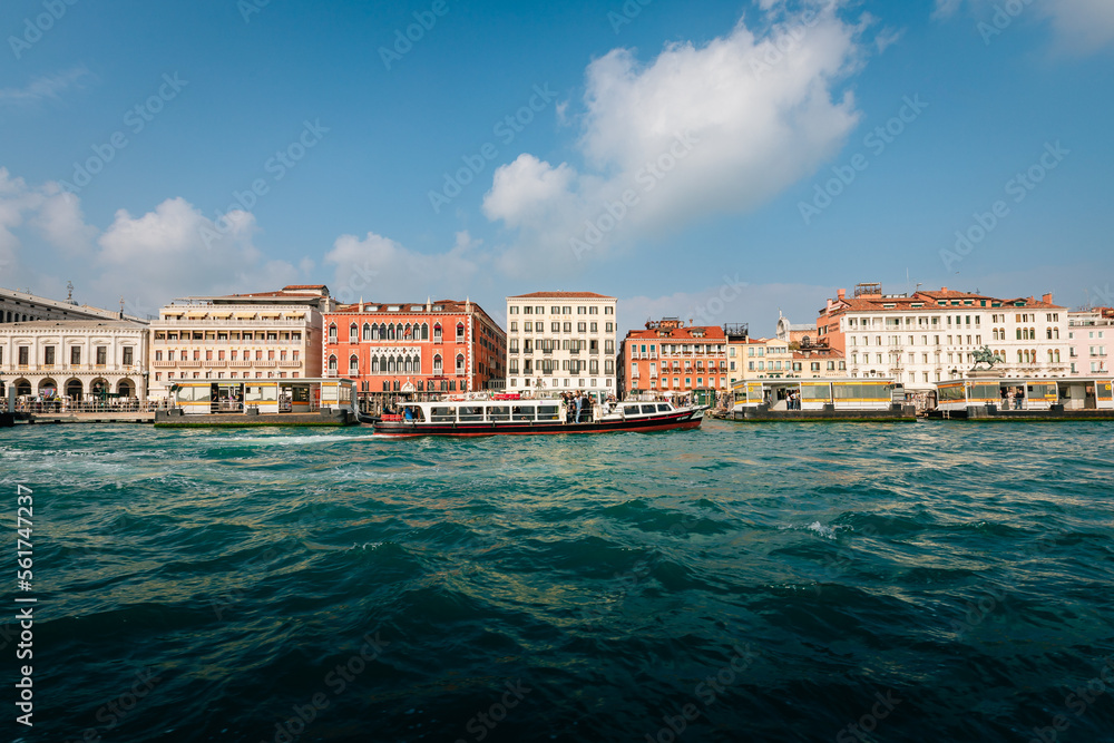 City of Venice view from sea with tourist boat