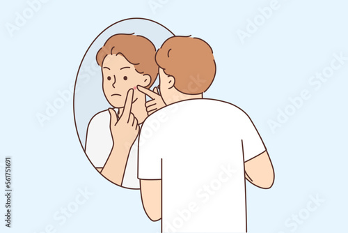 Young man stressed with pimple on face 