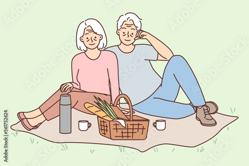 Happy mature couple enjoy picnic 