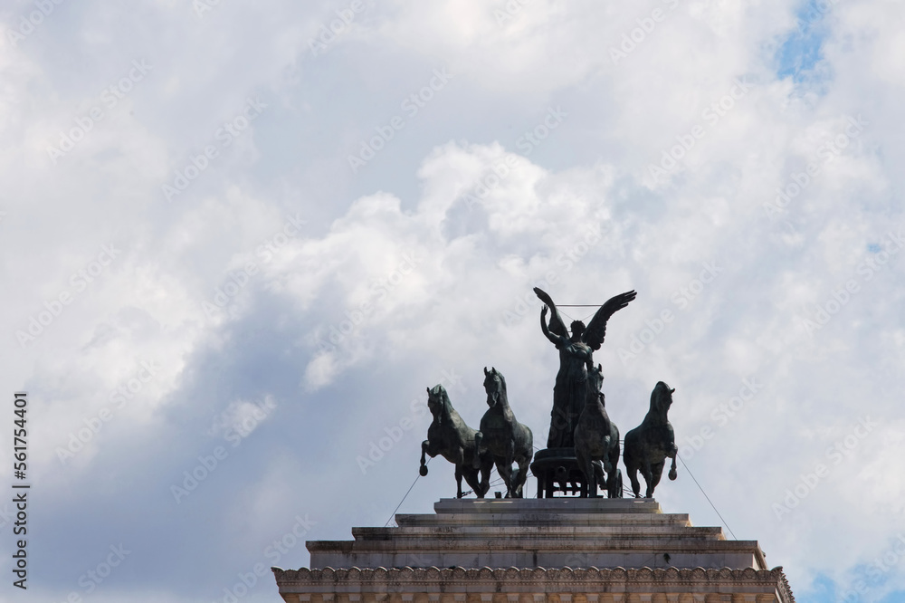 Statues at the top of famous Vittorio Emanuele II monument  building located in center of Rome, Italy