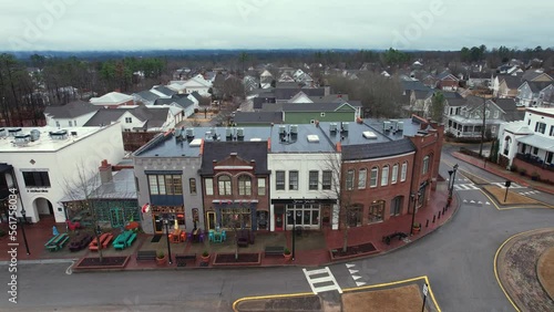 Aerial pull away of small town shops and eateries at Moss Rock Preserve in Hoover, Alabama photo