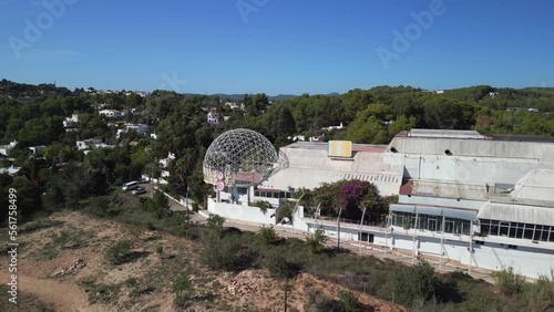Abandoned disco privelege. Smooth aerial view flight fly reverse drone
island ibiza, autumn 2022. High Quality 4k Cinematic footage