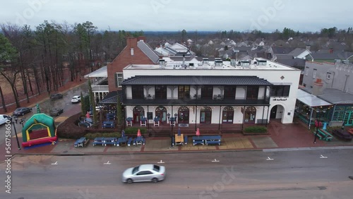 Aerial pan of quaint small town shops and eateries at Moss Rock Preserve in Hoover, Alabama photo