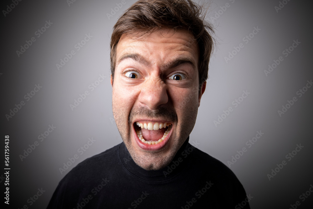 Wide angle lens close-up portrait. Furious man. Wide angle lens close-up portrait. Furious man.