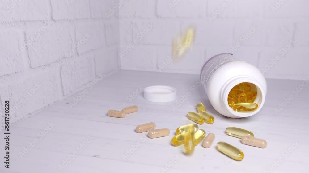 Slow-motion close-up of falling pills Slow-motion close-up of falling pills