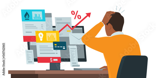 Man checking expensive utility bills online on his computer