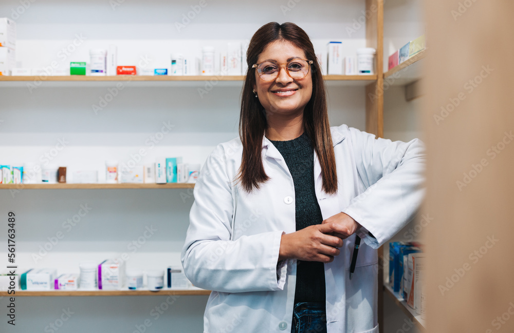 Female pharmacist standing in a drug store