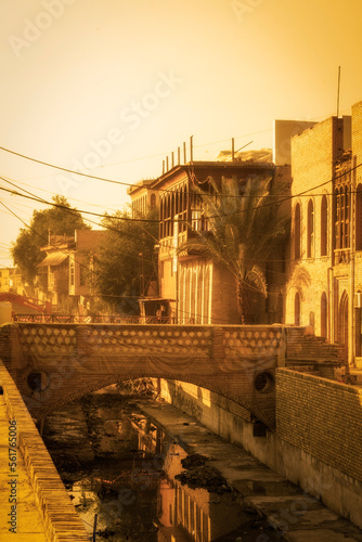 Terrace and bay window houses of Basra along a canal. Shanasheel is a Iraqi word for the finely crafted bay windows with intricate wooden latticework. photo