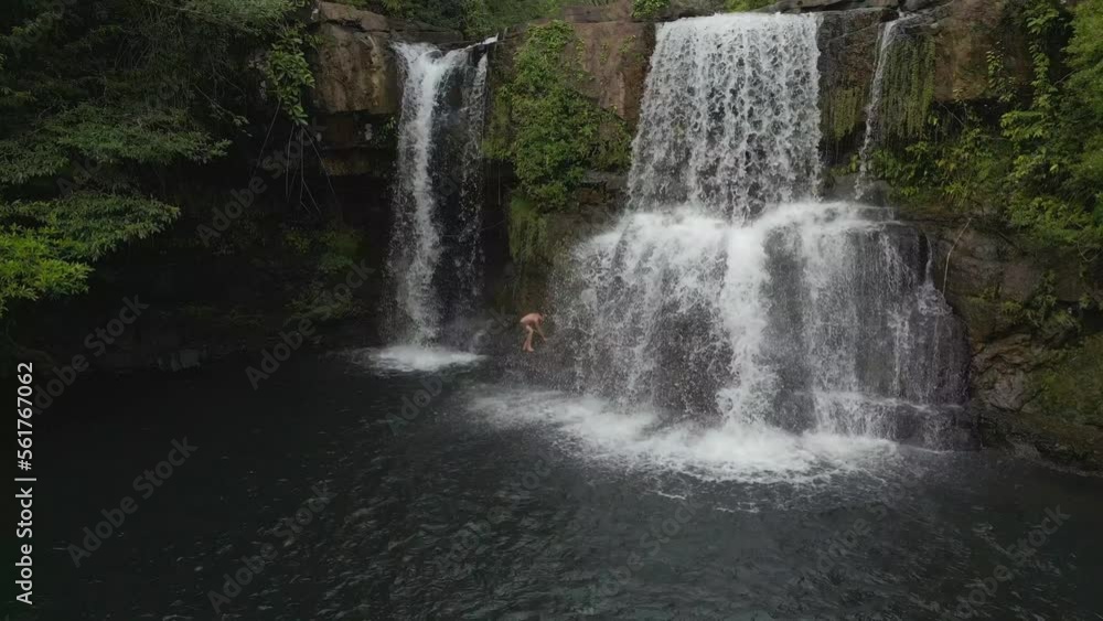 Indigenous man climbing jungle waterfall. Calm aerial view flight panorama overview drone
of thailand khlong chao on island ko kut, dezember 2022. High Quality 4k Cinematic footage Indigenous man climbing jungle waterfall. Calm aerial view flight panorama overview drone
of thailand khlong chao on island ko kut, dezember 2022. High Quality 4k Cinematic footage