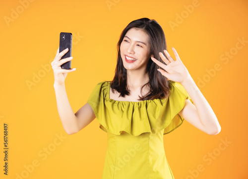 Image of beautiful young Asian woman on background