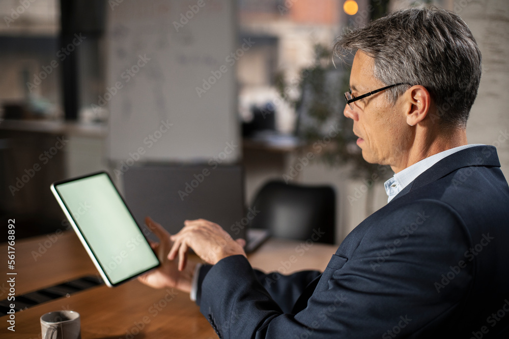 Close up of man using digital tablet. Close up of man using digital tablet.