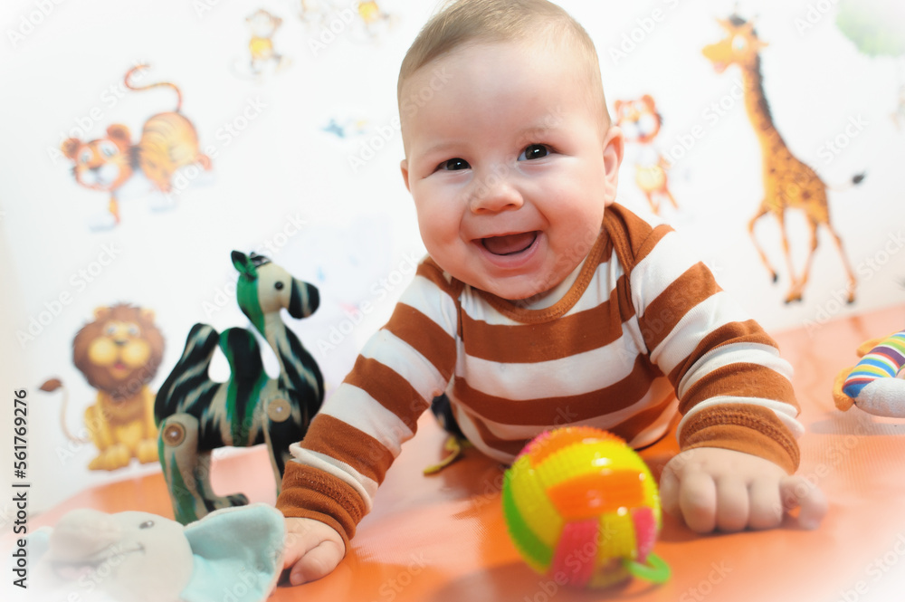 Portrait view of happy cute smiling baby. Joy and happiness concept. Love and family emotion Portrait view of happy cute smiling baby. Joy and happiness concept. Love and family emotion